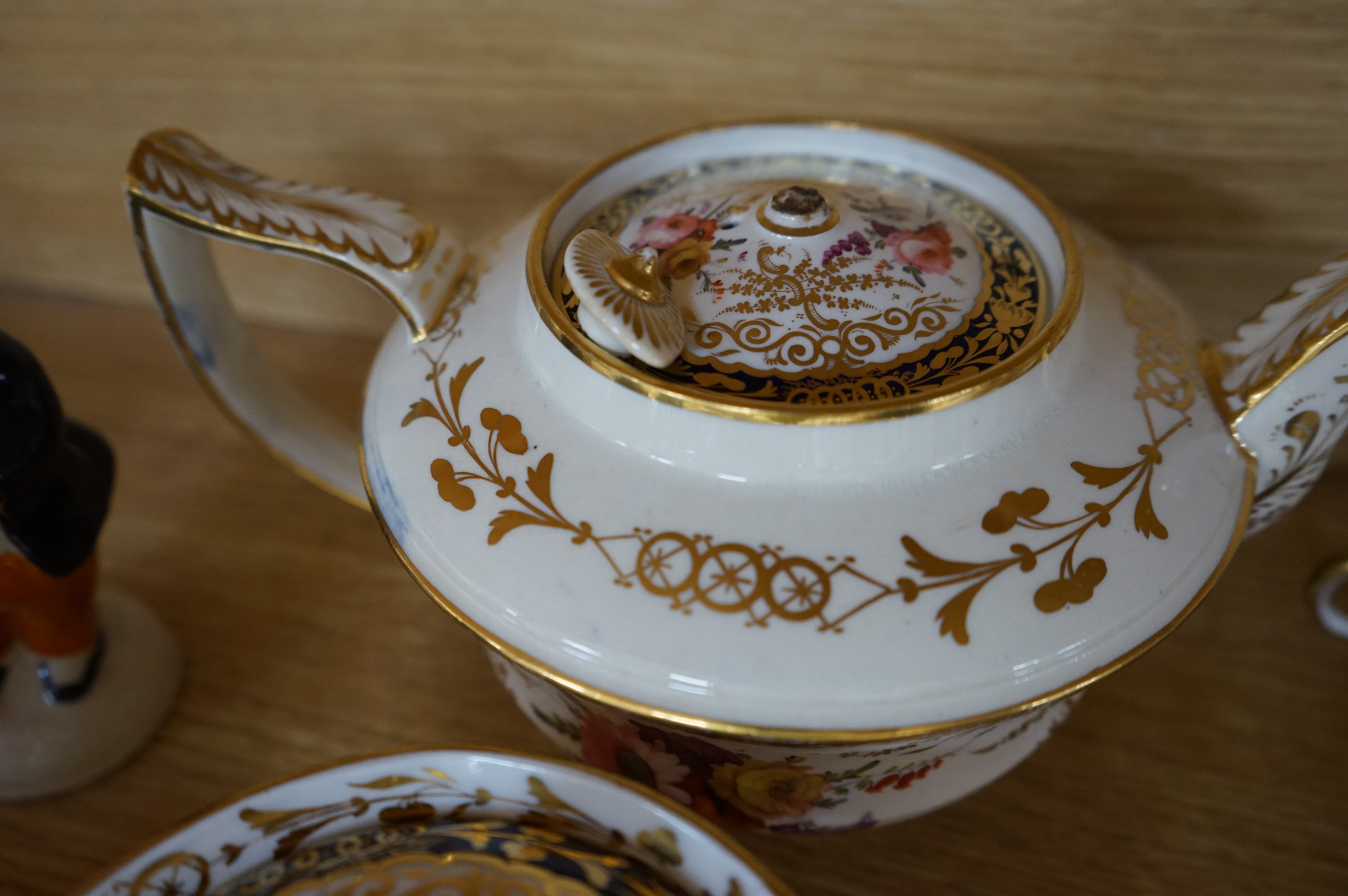 An English part teaset, c.1825 and six Royal Crown Derby coffee cans and saucers etc. Condition - some items cracked chipped and losses to gilding, teapot cover finial broken